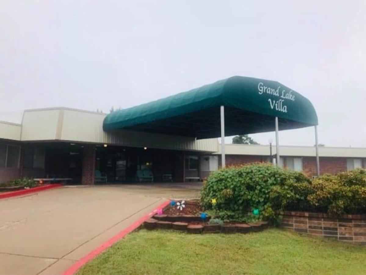 Green entrance canopy of Grand Lake Villa in Grove, Oklahoma
